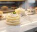Fresh cakes displayed in Transparent Cake Boxes at a modern bakery store